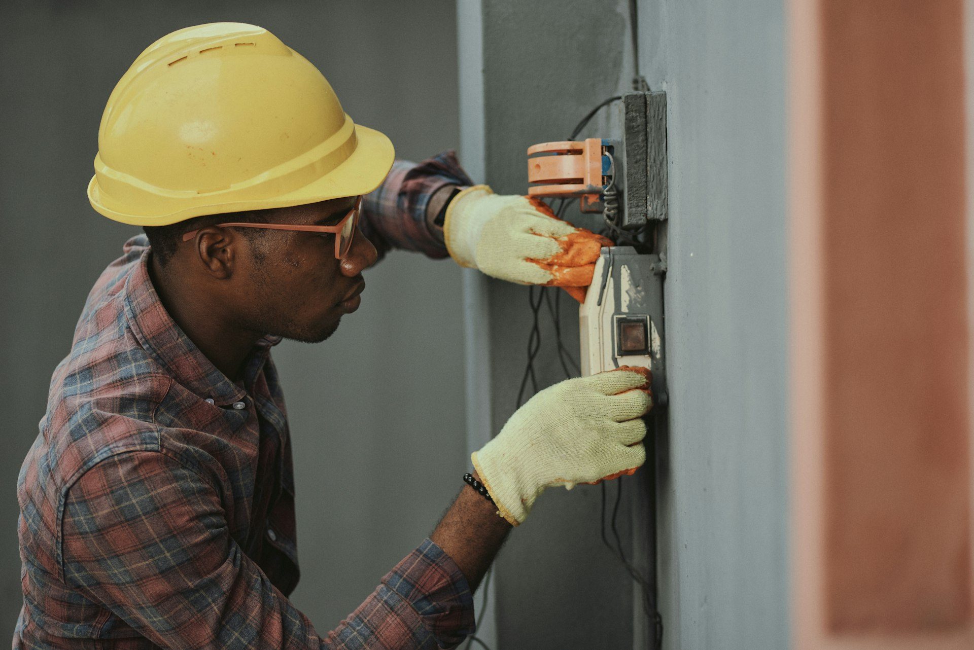 Electrical engineer inspecting a commercial distribution board